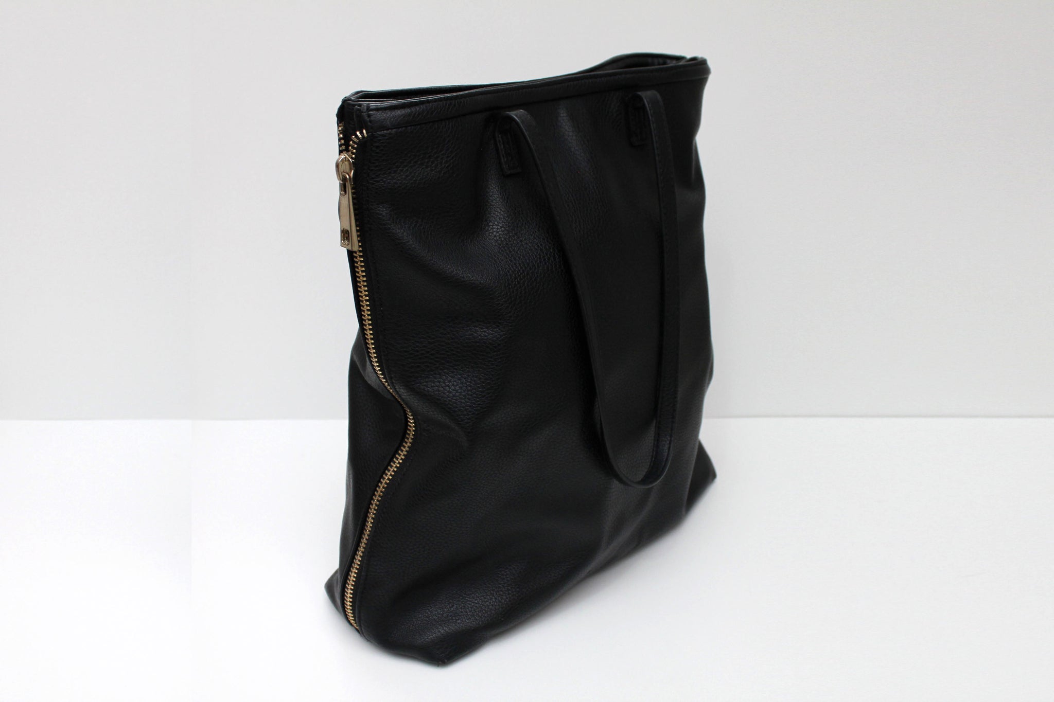 Tall black faux leather bag
